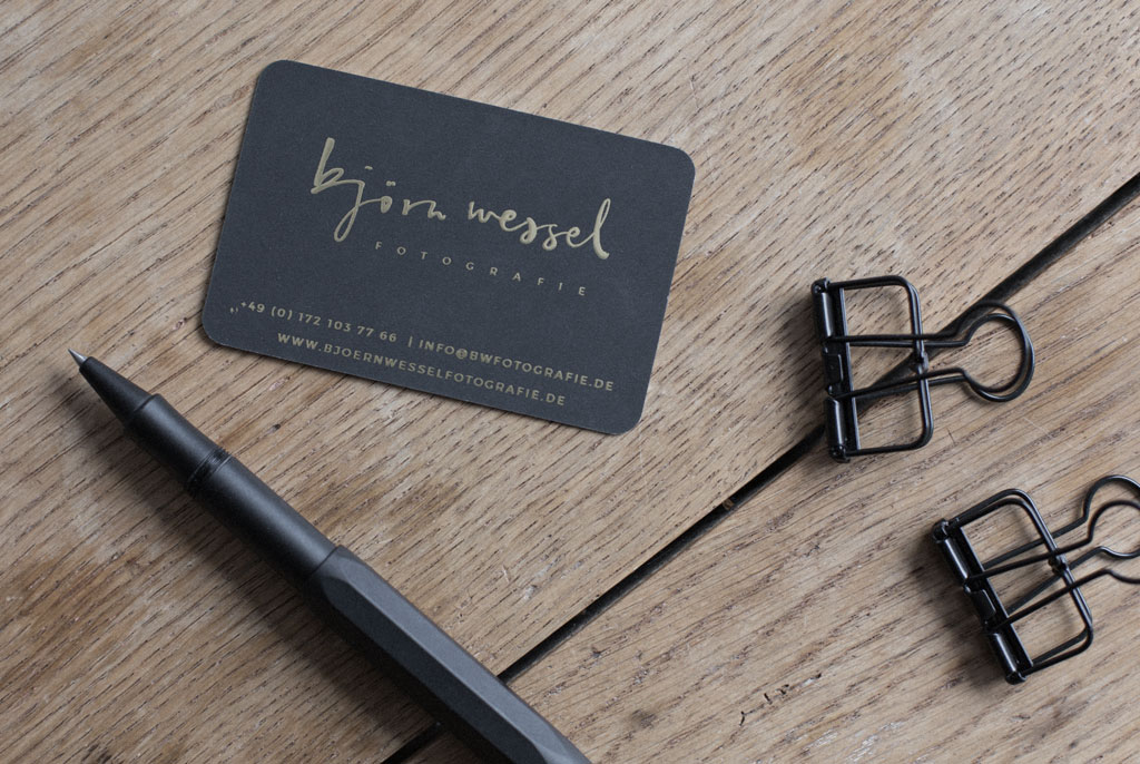 Black business cards with gold foiling